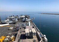 Amphibious assault ship USS Makin Island (LHD 8) departs the port of Duqm, Oman, after completing a maintenance and sustainment visit, March 26.