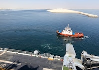 Amphibious assault ship USS Makin Island (LHD 8) departs the port of Duqm, Oman, after completing a maintenance and sustainment visit, March 26.