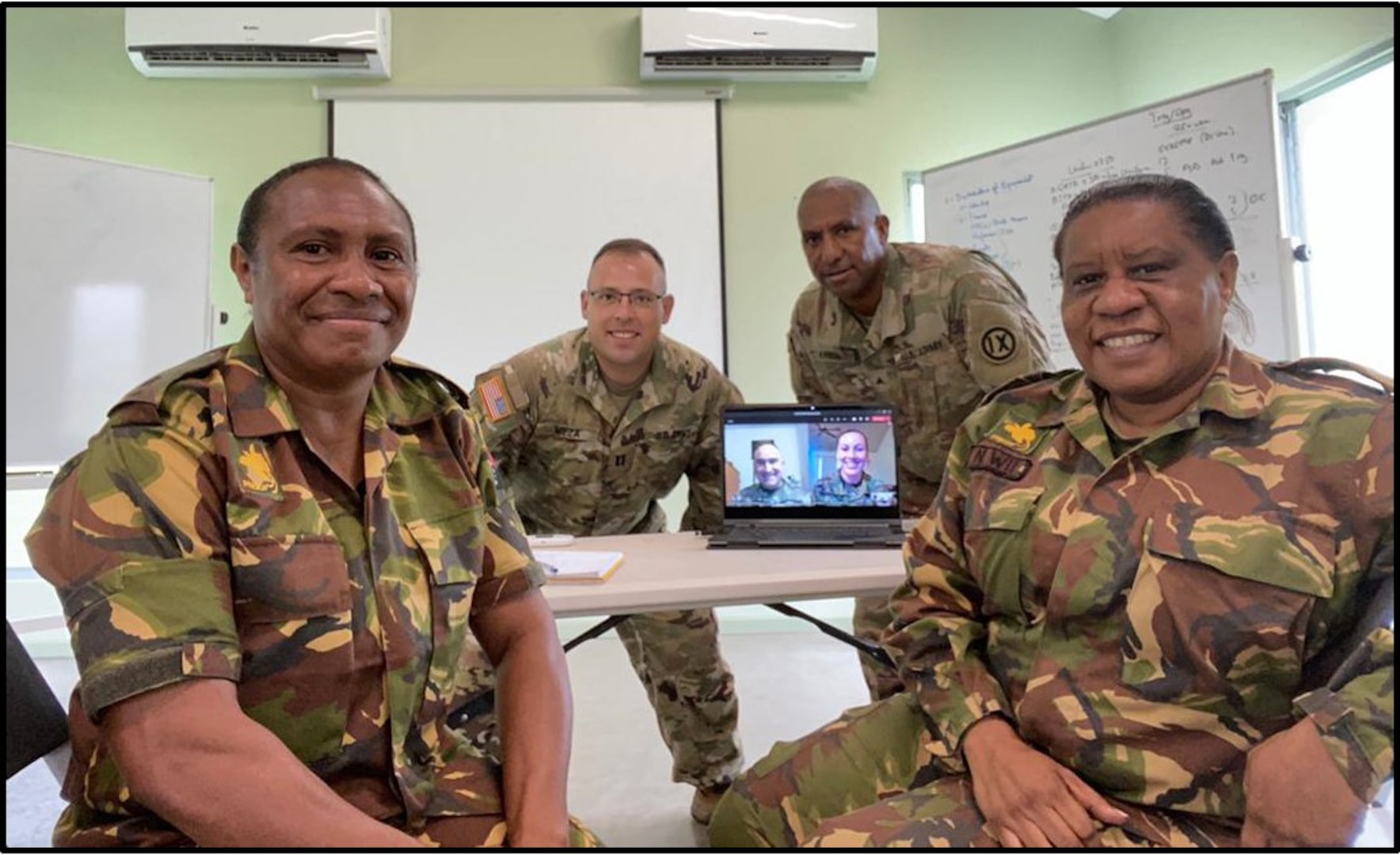 Members of the Wisconsin National Guard State Partnership Program and the Papua New Guinea Defense Force meet to discuss gender goals and policies in the Papua New Guinea Defence Force Feb. 18, 2021.