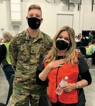 Army Sgt. Christian Grow, a combat medic assigned with the Michigan National Guard’s Task Force Red Lion COVID-19 Vaccination Testing Team, performed the Heimlich maneuver to save a choking nurse, Jacqueline Goldstein, during a COVID-19 vaccination clinic in Novi, Michigan, March 20, 2021.