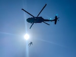 Staff Sgt. Jose Bulow, a flight medic with Golf Company, 1st Battalion, 168th Aviation Regiment (General Support Aviation Battalion), is hoisted into a UH-60 Black Hawk helicopter, March 26, 2021, at North Fort Hood, Texas, as part of training before a 9-month mission to the Middle East. Golf Company is attached to Task Force Phoenix, led by the California Army National Guard's 40th Combat Aviation Brigade.