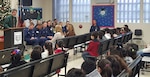 Faculty, staff, and students from Gibson Elementary School welcome PIE program volunteers and coordinators of Sector/Air Station Corpus Christi, Texas during the PIE Kickoff event in December 2019. Lt. Mark Currier played a pivotal role in bringing the PIE program to Gibson Elementary School.
