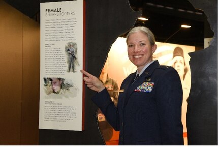 Illinois Air National Guard Capt. Jennifer Weitekamp, the first female sniper in the U.S. military, is among Air Force women featured in an exhibit at the National Museum of the U.S. Air Force at Wright-Patterson Air Force Base near Dayton, Ohio. Weitekamp is shown next to the Women in the Air Force exhibit March 5, 2021.