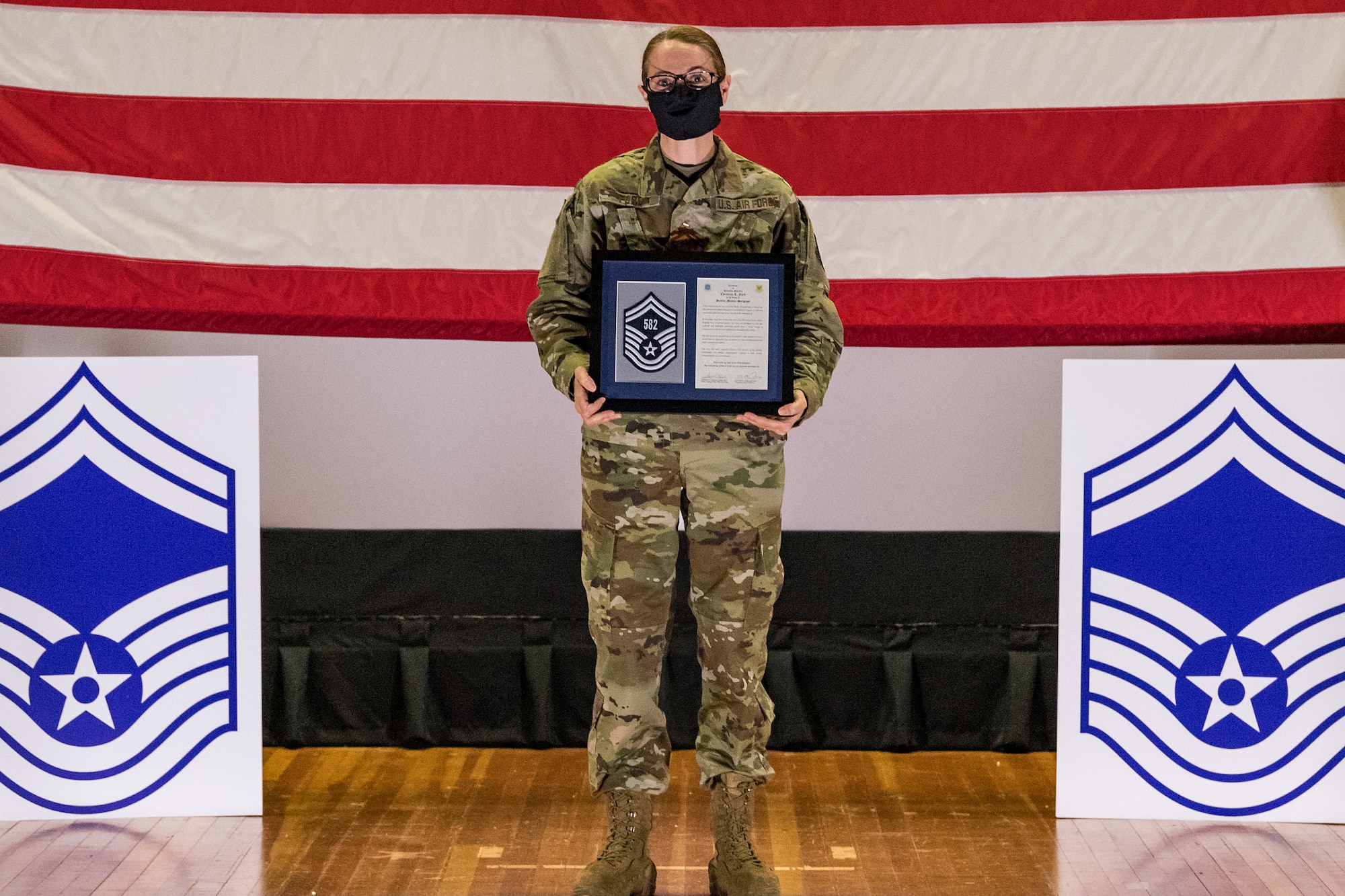 Master Sgt. Christina Ford, 436th Force Support Squadron career assistance advisor, poses for a photo during the senior master sergeant promotion release ceremony held at the base theater on Dover Air Force Base, Delaware, March 26, 2021. Ford was one of 10 master sergeants at Dover AFB selected for promotion to senior master sergeant in the 21E8 promotion cycle. (U.S. Air Force photo by Roland Balik)