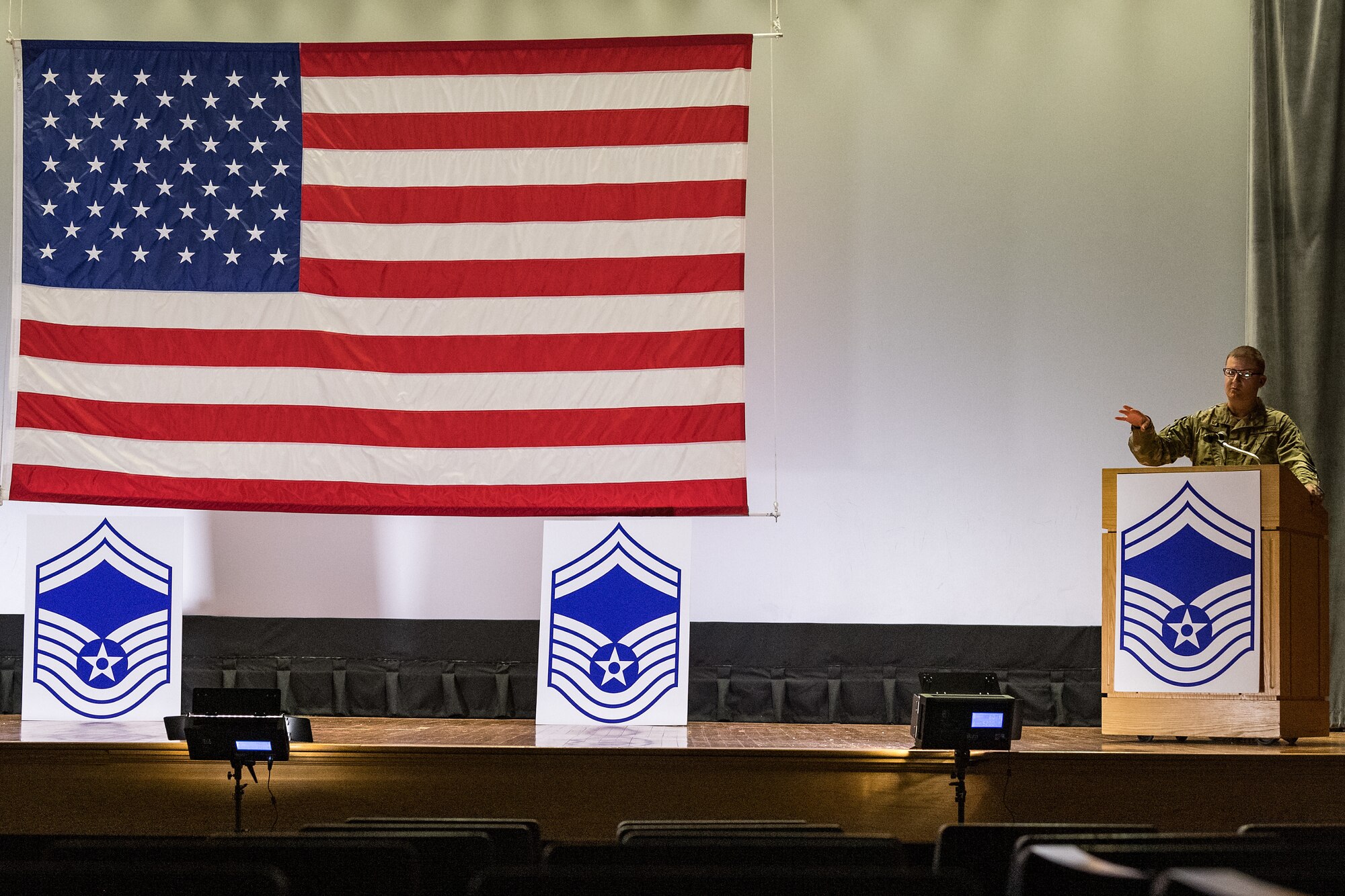 Col. Matthew Jones, 436th Airlift Wing commander, makes closing remarks during the senior master sergeant promotion release ceremony held at the base theater on Dover Air Force Base, Delaware, March 26, 2021. Ten master sergeants at Dover AFB were selected for promotion to senior master sergeant in the 21E8 promotion cycle. (U.S. Air Force photo by Roland Balik)