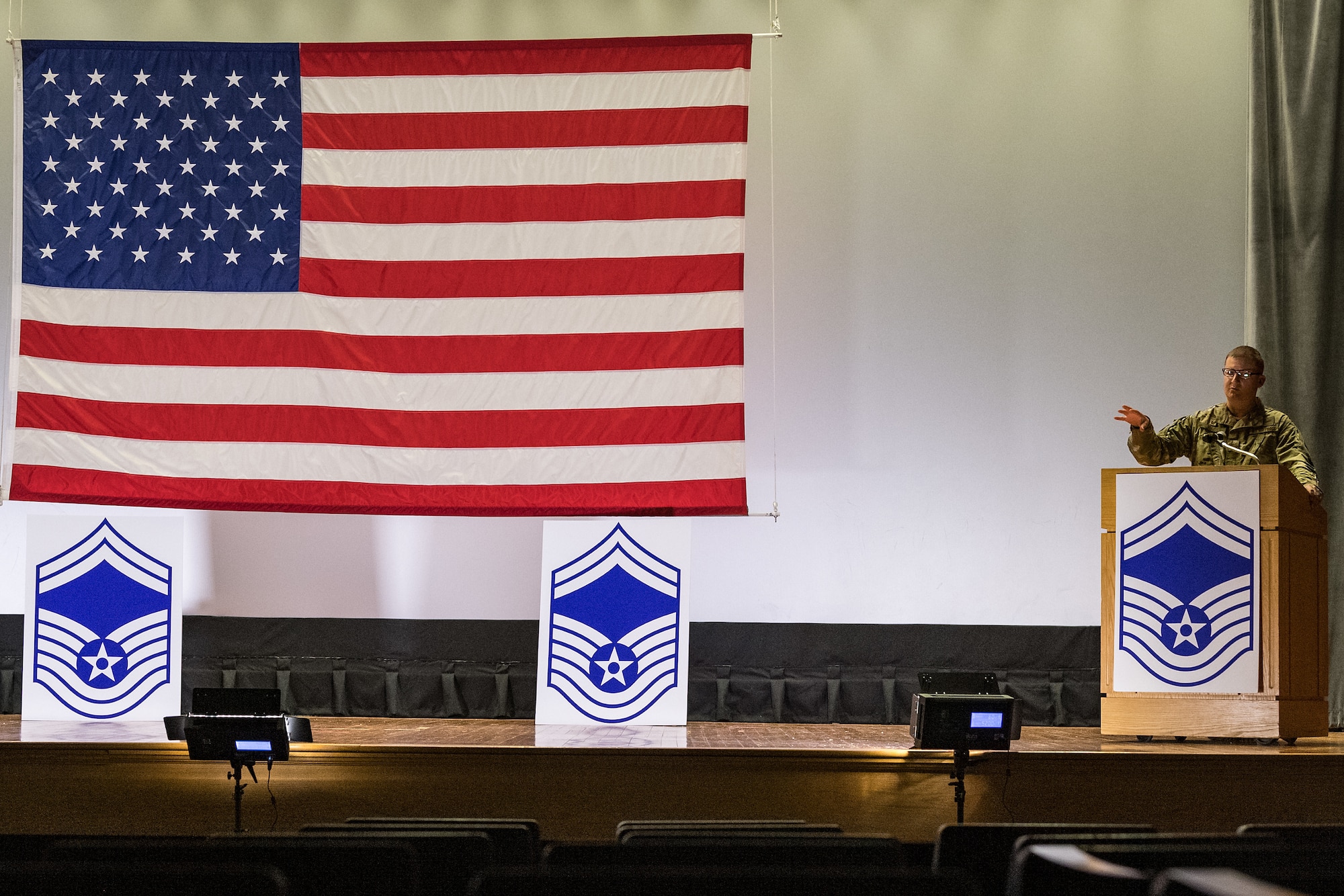 Col. Matthew Jones, 436th Airlift Wing commander, makes closing remarks during the senior master sergeant promotion release ceremony held at the base theater on Dover Air Force Base, Delaware, March 26, 2021. Ten master sergeants at Dover AFB were selected for promotion to senior master sergeant in the 21E8 promotion cycle. (U.S. Air Force photo by Roland Balik)