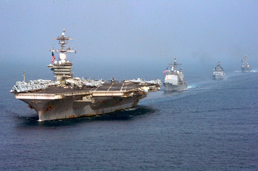 Four ships sail in formation.