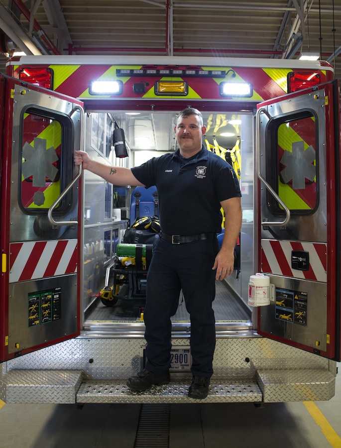 Firefighter Dalton Askew, a firefighter at Cherry Point Fire and Emergency Services, and the recipient of the 2020 Emergency Medical Services (EMS) Provider of the Year award, stands on the back of an ambulance at Marine Corps Air Station Cherry Point, North Carolina, Feb. 26, 2021. Askew’s dedication to what he does, care for the community, proficiency within the fire department, and ability to take initiative and be leader in a time of need, set him apart from his peers. (U.S. Marine Corps photo taken by Pfc. Michael Neuenhoff)
