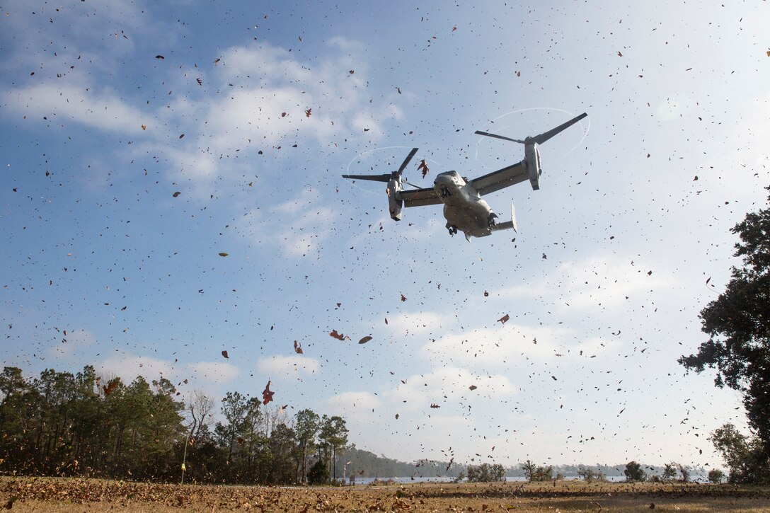 A U.S. Marine Corps MV-22 Osprey assigned to Marine Medium Tiltrotor Squadron 263, 2nd Marine Aircraft Wing, prepares to land during an Initial Response Team (IRT) fly-away drill on Camp Lejeune, N.C., Jan. 14, 2021. An IRT with 2nd Marine Expeditionary Brigade (2nd MEB) took off from Camp Lejeune to Marine Corps Auxiliary Landing Field Bogue to simulate a forward theater deployment to establish a command and control communication node for 2nd MEB. 2nd MEB’s training and education creates a deployable force prepared to move on a moment’s notice. (U.S. Marine Corps photo by Sgt. Jesus Sepulveda Torres)