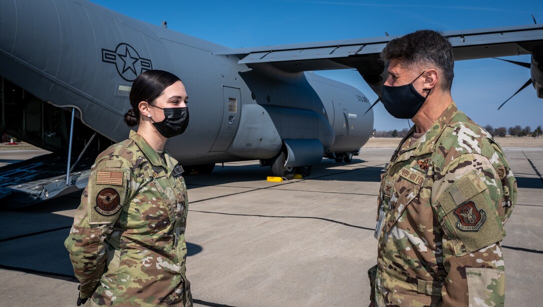 Col. Glenn Collins, 932nd Airlift Wing commander, chats with Senior Airman Giovanna Chavez, 932nd Aeromedical Evacuation Squadron technician, March 7, 2021, Scott Air Force Base, Illinois.  Chavez was selected as an Airman Spotlight and Collins presented her with a Wing coin. (U.S. Air Force photo by Christopher Parr)