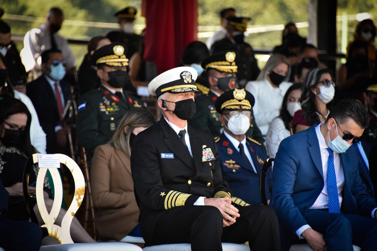 Navy admiral sits with partner nation military leaders.