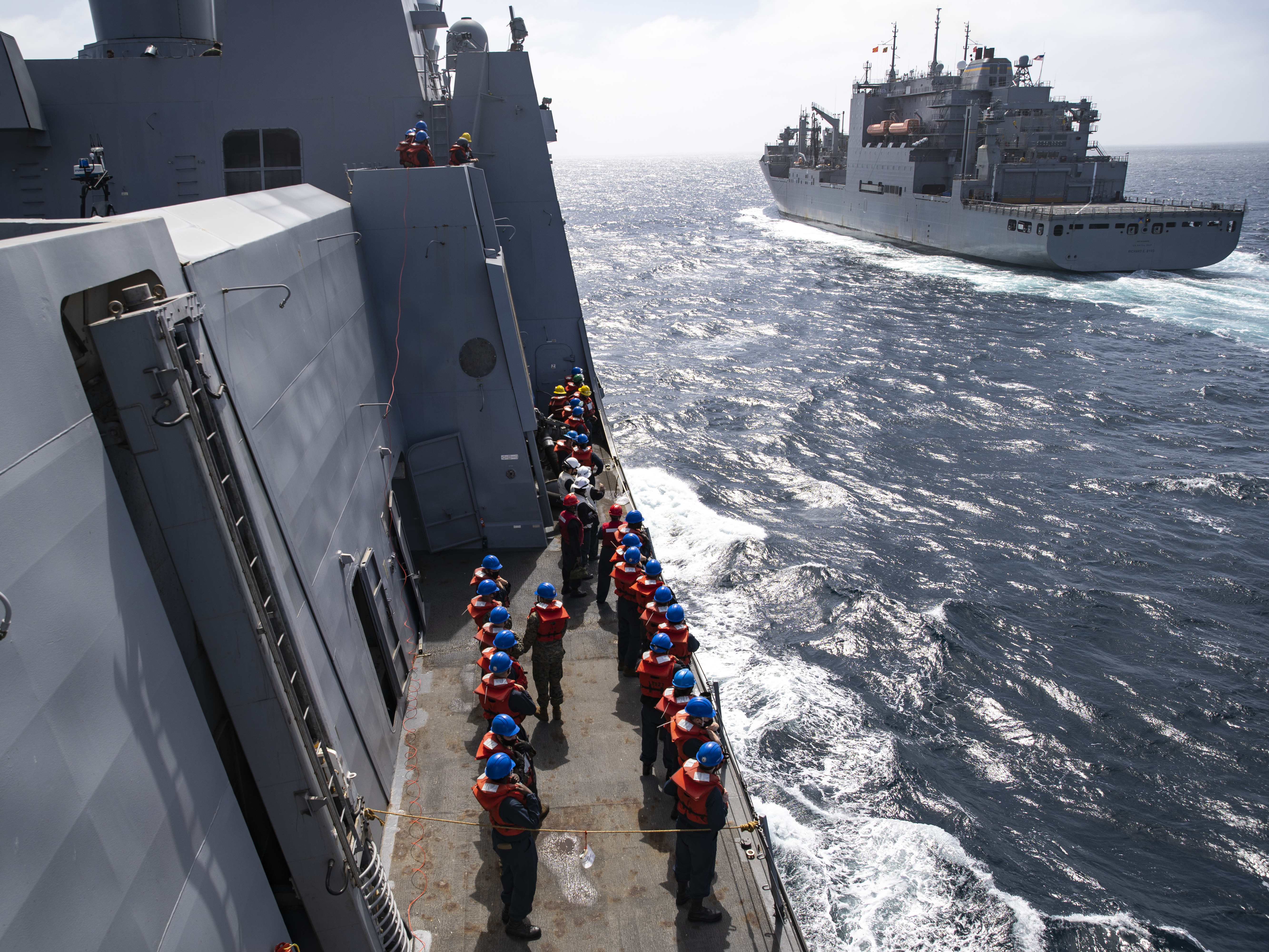 USS Portland (LPD 27) prepare to conduct a replenishment-at-sea with   USNS Richard E. Byrd (T-AKE 4).