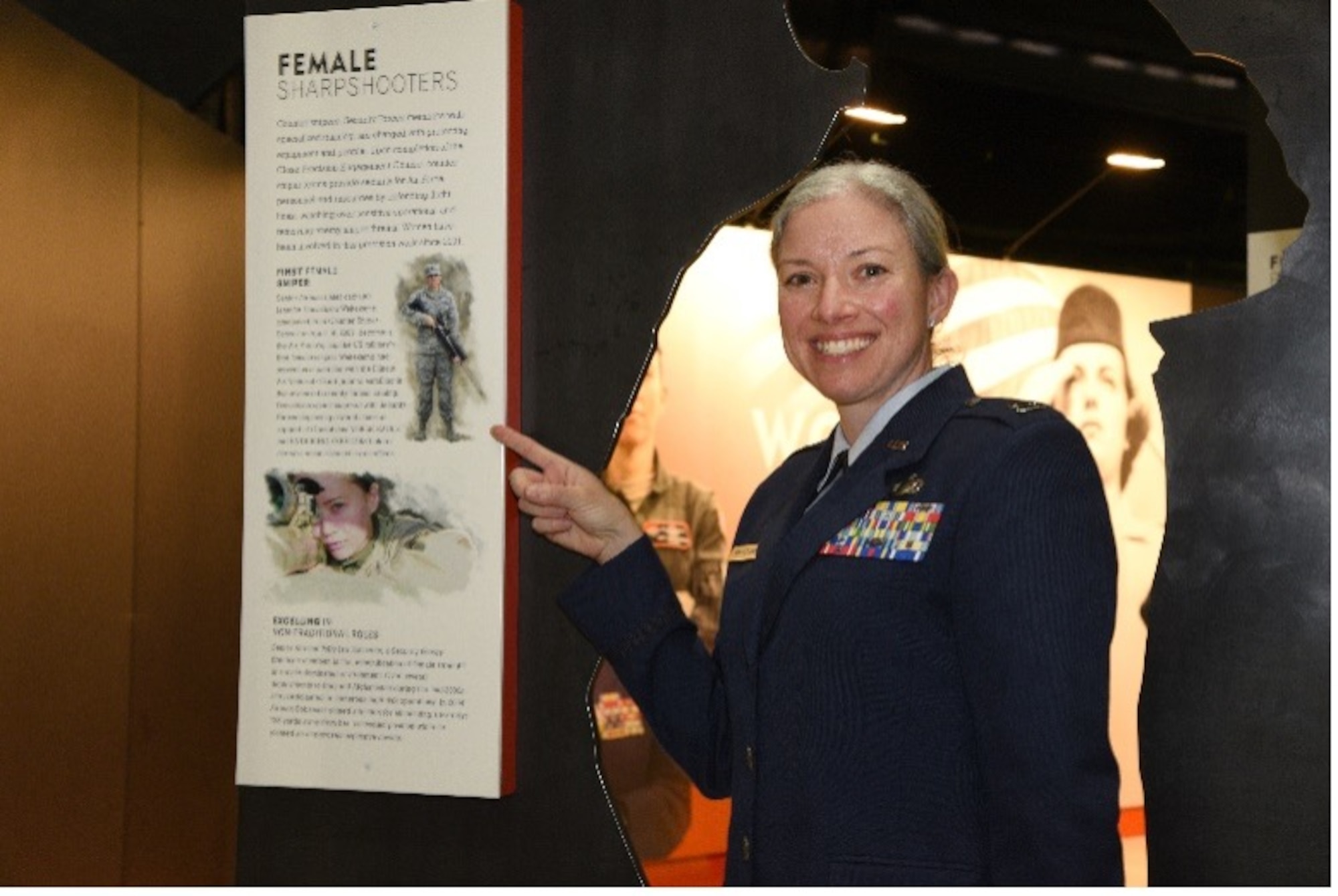 Illinois Air National Guard Capt. Jennifer Weitekamp, the first female sniper in the U.S. military, is among Air Force women featured in an exhibit at the National Museum of the U.S. Air Force at Wright-Patterson Air Force Base near Dayton, Ohio. Weitekamp is shown next to the Women in the Air Force exhibit March 5, 2021.