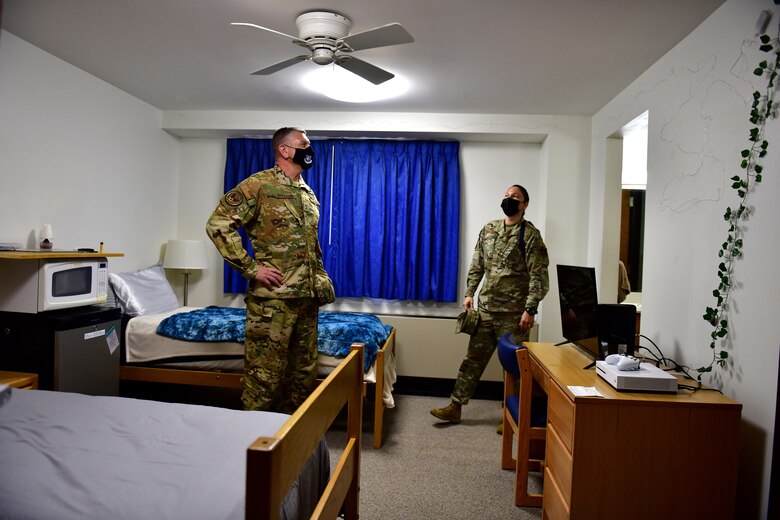 General tours dormitory with military training leaders.