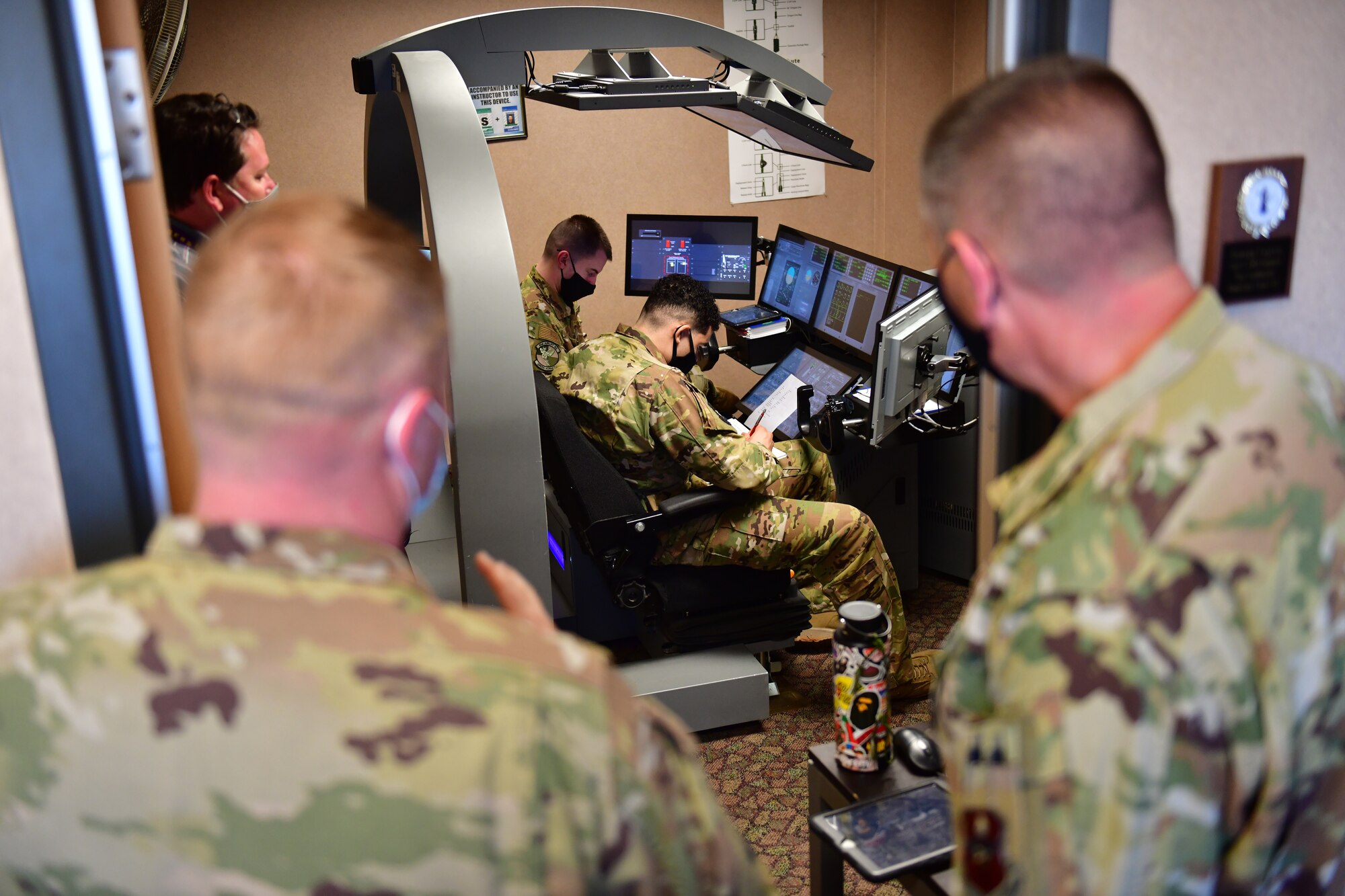 Airman receives overview of fuselage trainer.