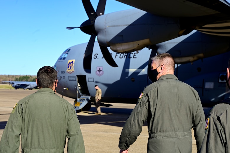 Airmen make their way to a C-130J Super Hercules.