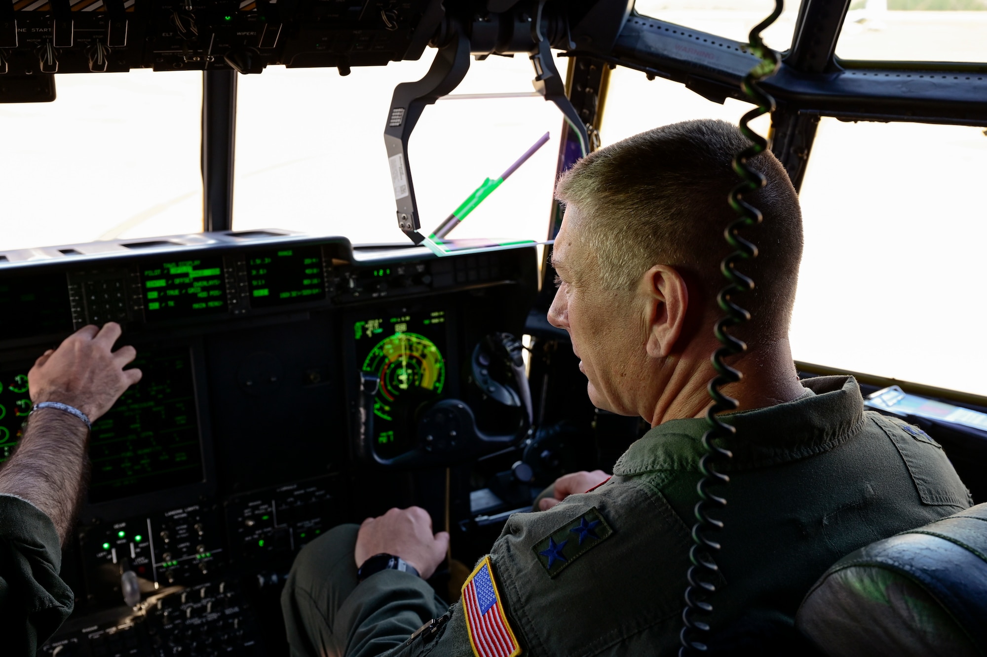 Airmen conduct pre-flight checks on a C-130J Super Hercules.