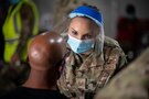 U.S. Air Force Airman 1st. Class Linzie Avalos, deployed from Peterson Air Force Base, Colorado, prepares to vaccinate a Tampa community member at the Tampa Community Vaccination Center March 12, 2021 in Tampa, Florida. Avalos is one of nearly 140 Airmen on site at the state-led, federally-supported operation. U.S. Northern Command, through U.S. Army North, remains committed to providing continued, flexible Department of Defense support to the Federal Emergency Management Agency as part of the whole-of-government response to COVID-19. (U.S. Air Force photo by Master Sgt. Holly Roberts-Davis/Luke AFB Public Affairs)