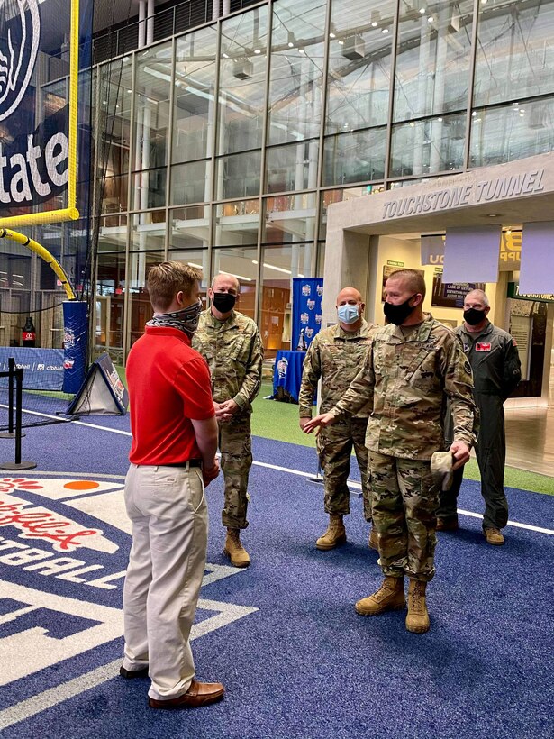 Devon Miller talks to Army Maj. Gen. Tom Carden, the adjutant general of the Georgia Department of Defense, prior to swearing into the Georgia Air National Guard at a ceremony at the Chick-fil-A College Football Hall of Fame, Mar. 24, 2021.