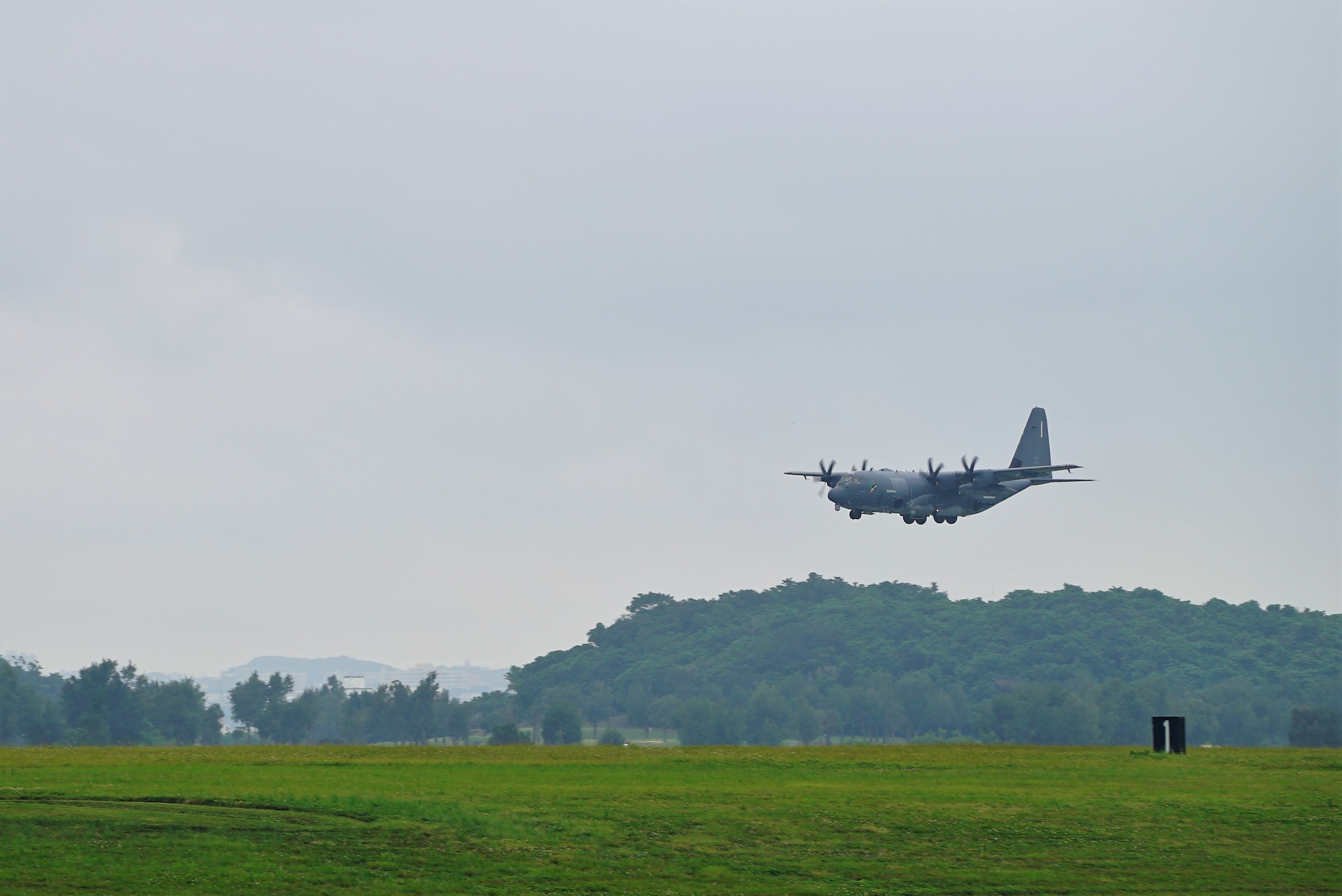 An AC-130J Ghostrider approaches the runway on a final landing at Kadena Air Base.