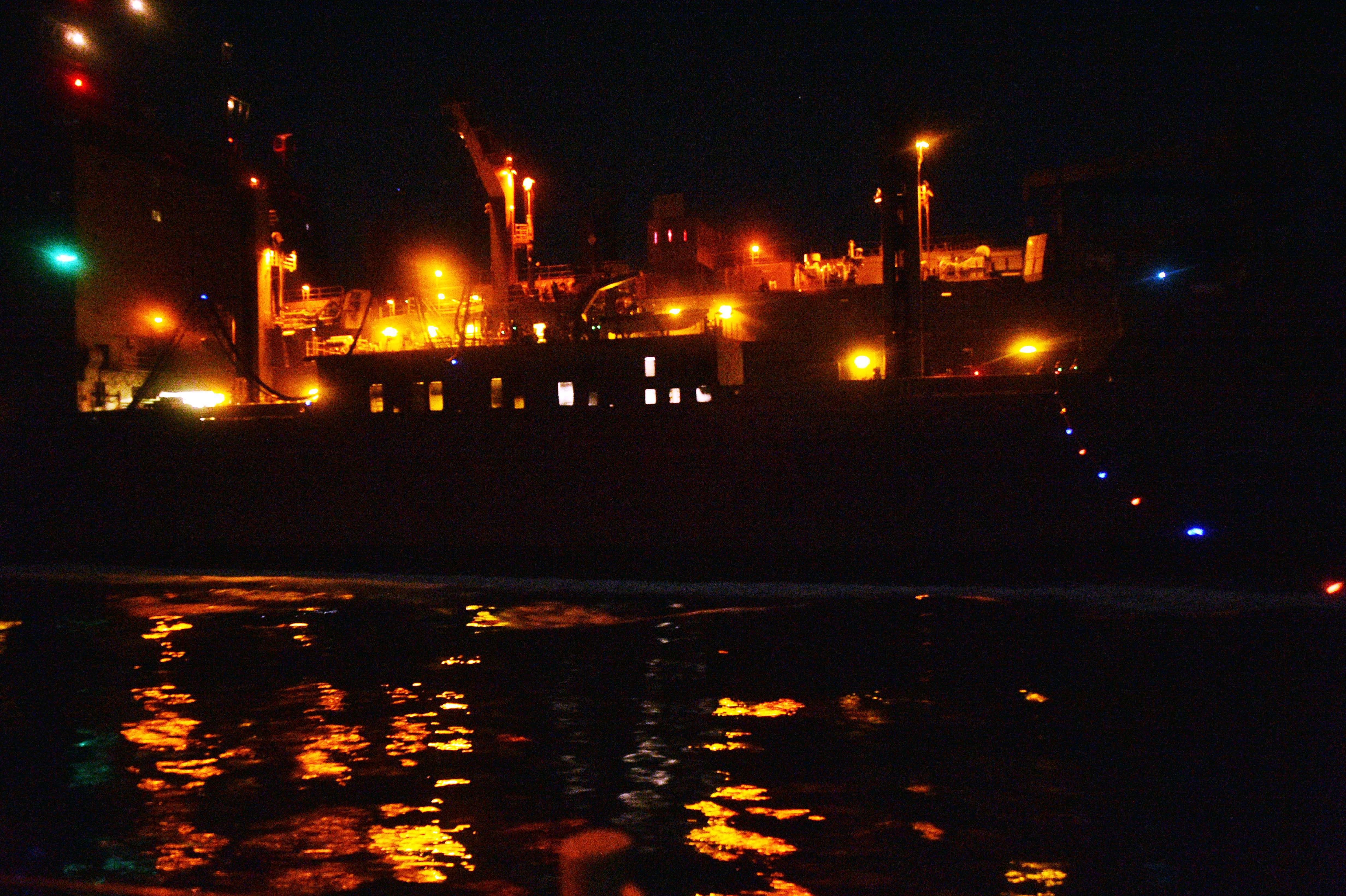 The Military Sealift Command dry cargo and ammunition ship USNS Carl Brashear (T-AKE 7) conducts a replenishment-at-sea with guided-missile cruiser USS Philippine Sea (CG 58), not pictured, in the Gulf of Oman.