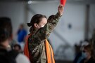 U.S. Air Force Capt. Stephanie McIlwraith, deployed from Peterson Air Force Base, Colorado, directs a community member in the observation tent at the Tampa Community Vaccination Center in Tampa, Florida, March 5, 2021. McIlwraith is one of nearly 140 Airmen on site at the state-led, federally-supported operation. U.S. Northern Command, through U.S. Army North, remains committed to providing continued, flexible Department of Defense support to the Federal Emergency Management Agency as part of the whole-of-government response to COVID-19. (U.S. Air Force photo by Master Sgt. Holly Roberts-Davis/Luke AFB Public Affairs)