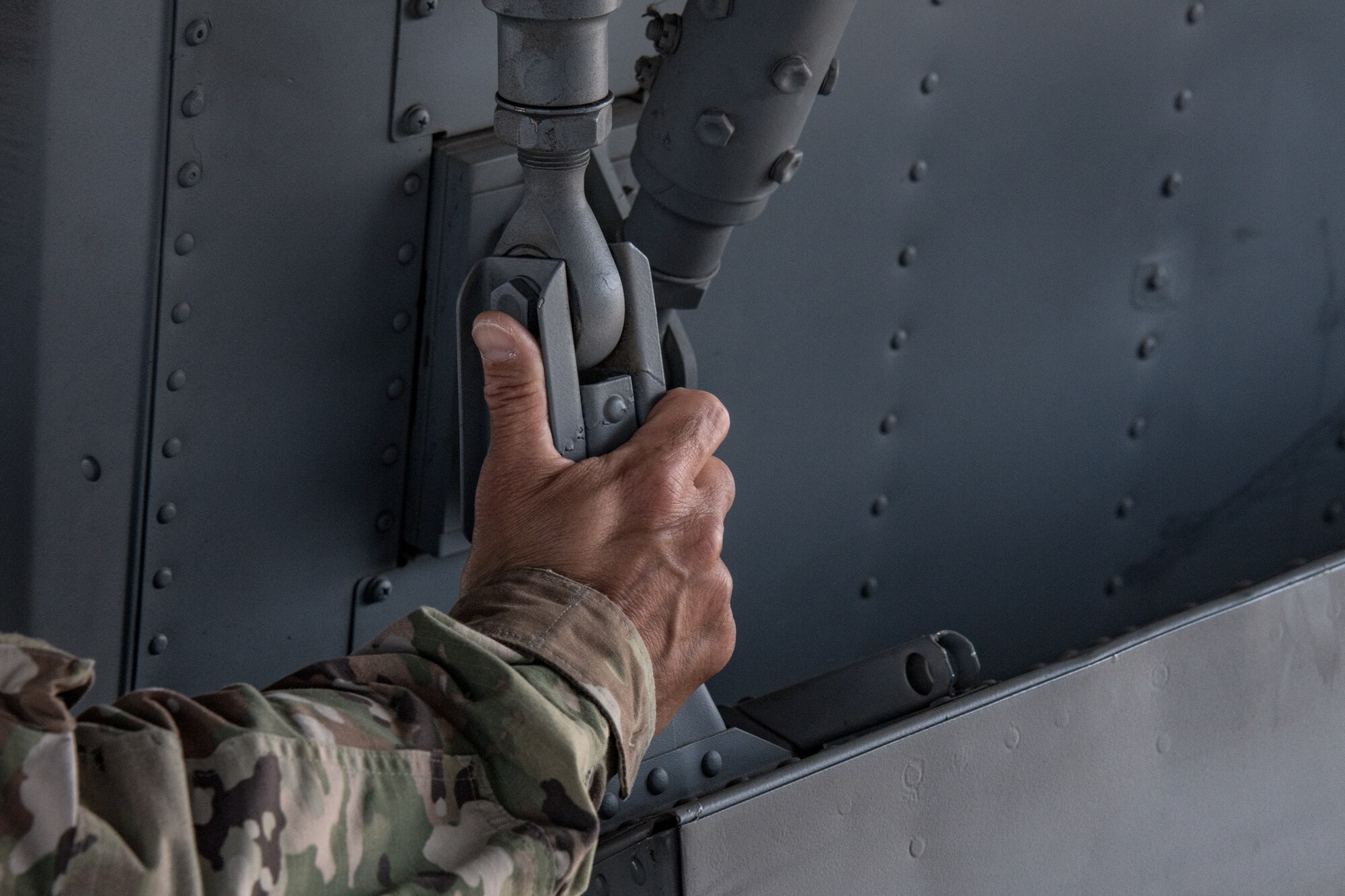 a man inspects a kc-135 aircraft