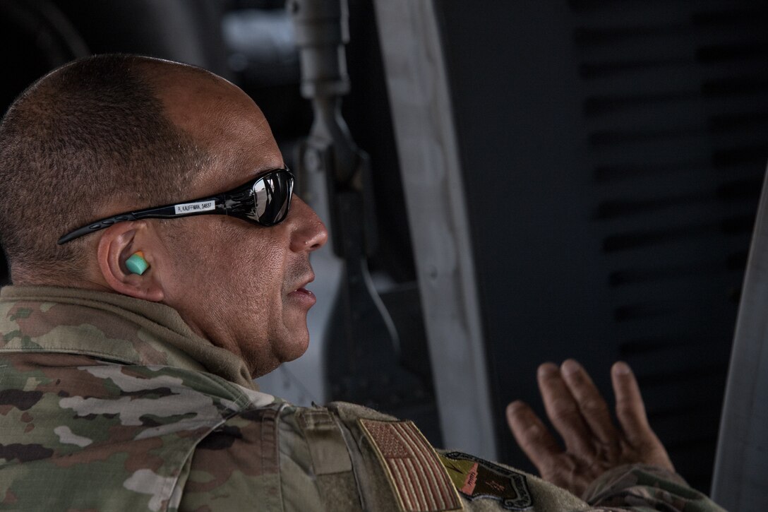 a man inspects a KC-135 aircraft