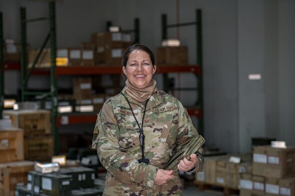 a woman poses for a portrait in uniform