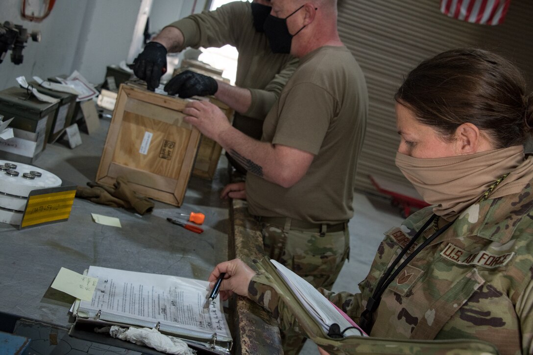 an airman checks an inspection list