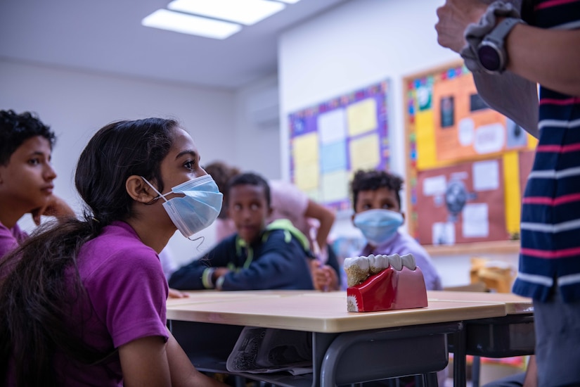 A student at the International School of Africa watches the preventative oral health care demonstration at Arta, Djibouti, March 23, 2021. With these demonstrations the Civil Affairs East Africa Southern European Task Force Africa (CA-EA SETAF-AF) functional specialty team, in support of Combined Joint Task Force-Horn of Africa (CJTF-HOA), is able to teach children the importance of oral health care starting at a young age.