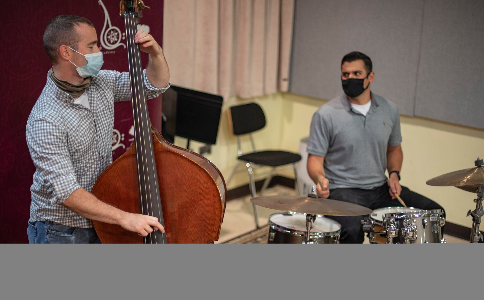 Senior Airman Dominic Sbrega (left) and Staff Sgt. Michael Coletti, U.S. Air Forces Central Band musicians, perform a jazz-improv routine at the Qatar Music Academy in Doha, Qatar, March 24, 2021. The AFCENT Band perform and tour in small ensembles throughout the region to promote positive troop morale, diplomacy and outreach to host-nation communities. (U.S. Air Force photo by Tech. Sgt. Travis Edwards)