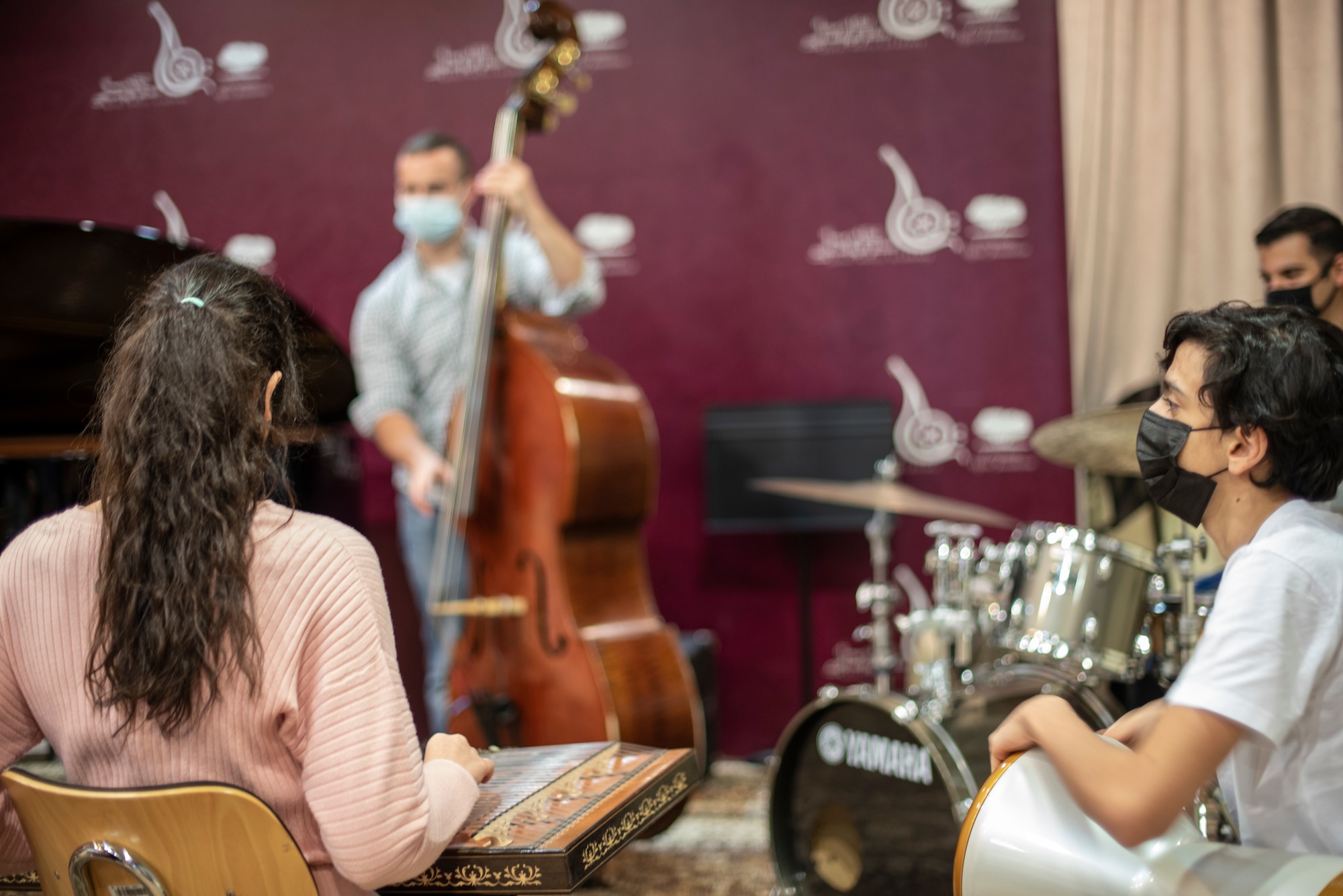Qatar Music Academy students play jazz-improv with the U.S. Air Forces Central Band during an engagement at the academy in Doha, Qatar, March 24, 2021. The AFCENT Band perform and tour in small ensembles throughout the region to promote positive troop morale, diplomacy and outreach to host-nation communities. (U.S. Air Force photo by Tech. Sgt. Travis Edwards)