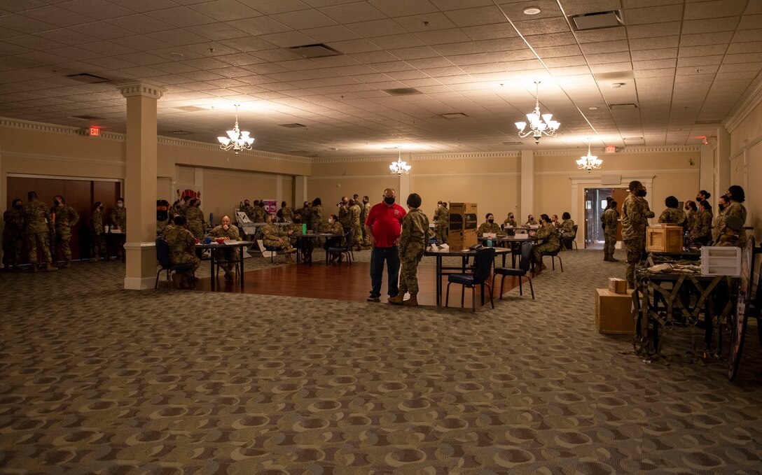 Military members and civilians of the Seymour Johnson community socialize during the Military Women Air Force Specialty Code Showcase at Seymour Johnson Air Force Base, North Carolina, March 26, 2021.