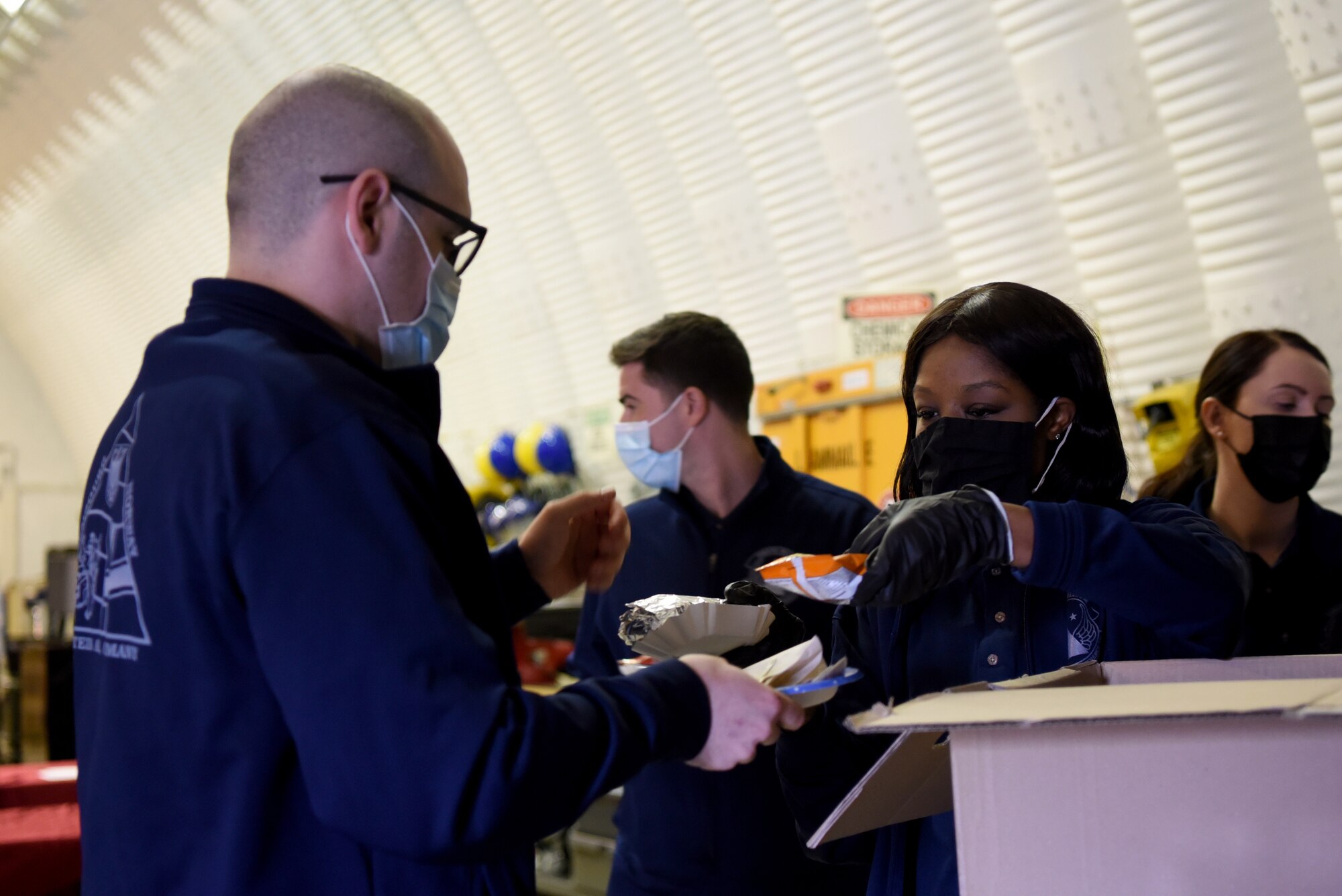 U.S. Air Force Senior Master Sgt. Rashonda Coleman, 86th Materiel Maintenance Squadron superintendent, serves lunch to members of her unit.