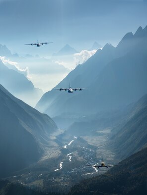 Three aircraft flying in a valley