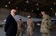 Acting Secretary of the Air Force John Roth interacts with Airmen by an MQ-9 Reaper.