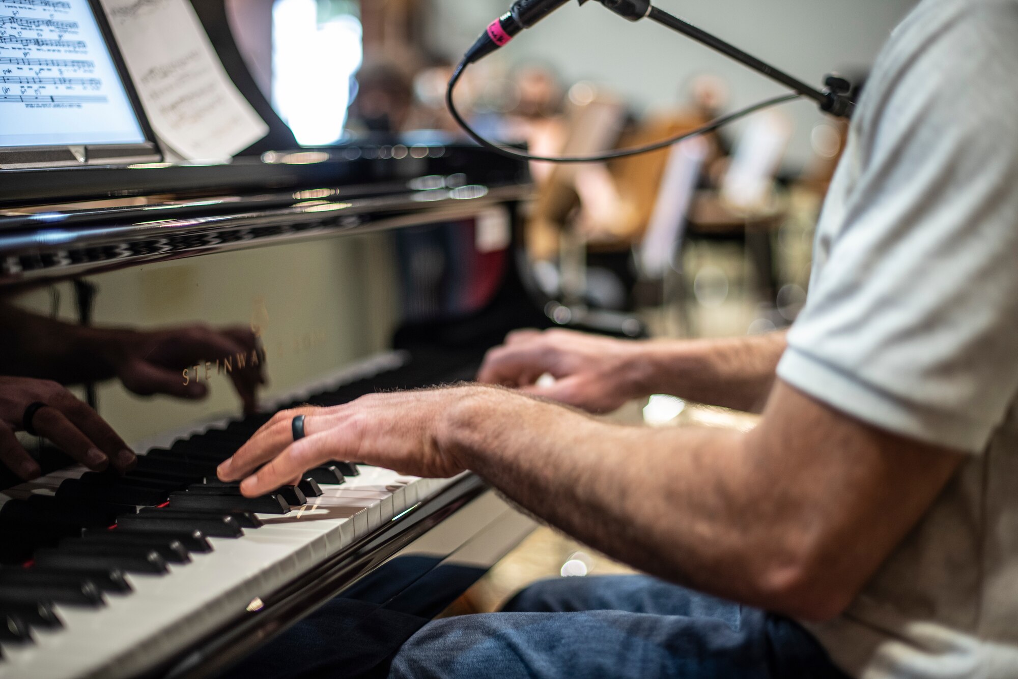 Tech. Sgt. Craig Larimer, U.S. Air Forces Central Band musician, plays the piano at the Qatar Music Academy in Doha, Qatar, March 24, 2021. The AFCENT Band perform and tour in small ensembles throughout the region to promote positive troop morale, diplomacy and outreach to host-nation communities. (U.S. Air Force photo by Tech. Sgt. Travis Edwards)