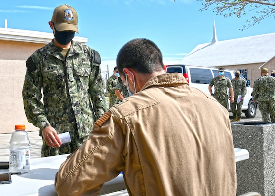 EL CENTRO, Calif. (March 25, 2021) Lt. Nicholas Blonien, flight surgeon, Naval Air Facility (NAF) El Centro provides medical screening to Sailors onboard NAF El Centro during the second dose of COVID-19 vaccinations March 25, 2021. NAF El Centro supports combat training and readiness of the warfighter. This includes air operations support to operational fleet and training squadrons as well as squadrons from other services (Marine Corps, Army, Air Force) and international military partners. (U.S. Navy photo by Mass Communication Specialist 3rd Class Drew Verbis/Released)