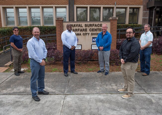 The Quickstrike 64 Team from Naval Surface Warfare Center Panama City Division (NSWC PCD) Quickstrike 64 Team members pose for a team photo. Pictured from left to right: John Sojdehei, Bill Vandiver, Jomo Martin, Tom Frederick, Tim Pham, and Ken Ford. Not pictured above, but also included on the team, is Sascha Dastgerdi. U.S. Navy photo by Ronald Newsome