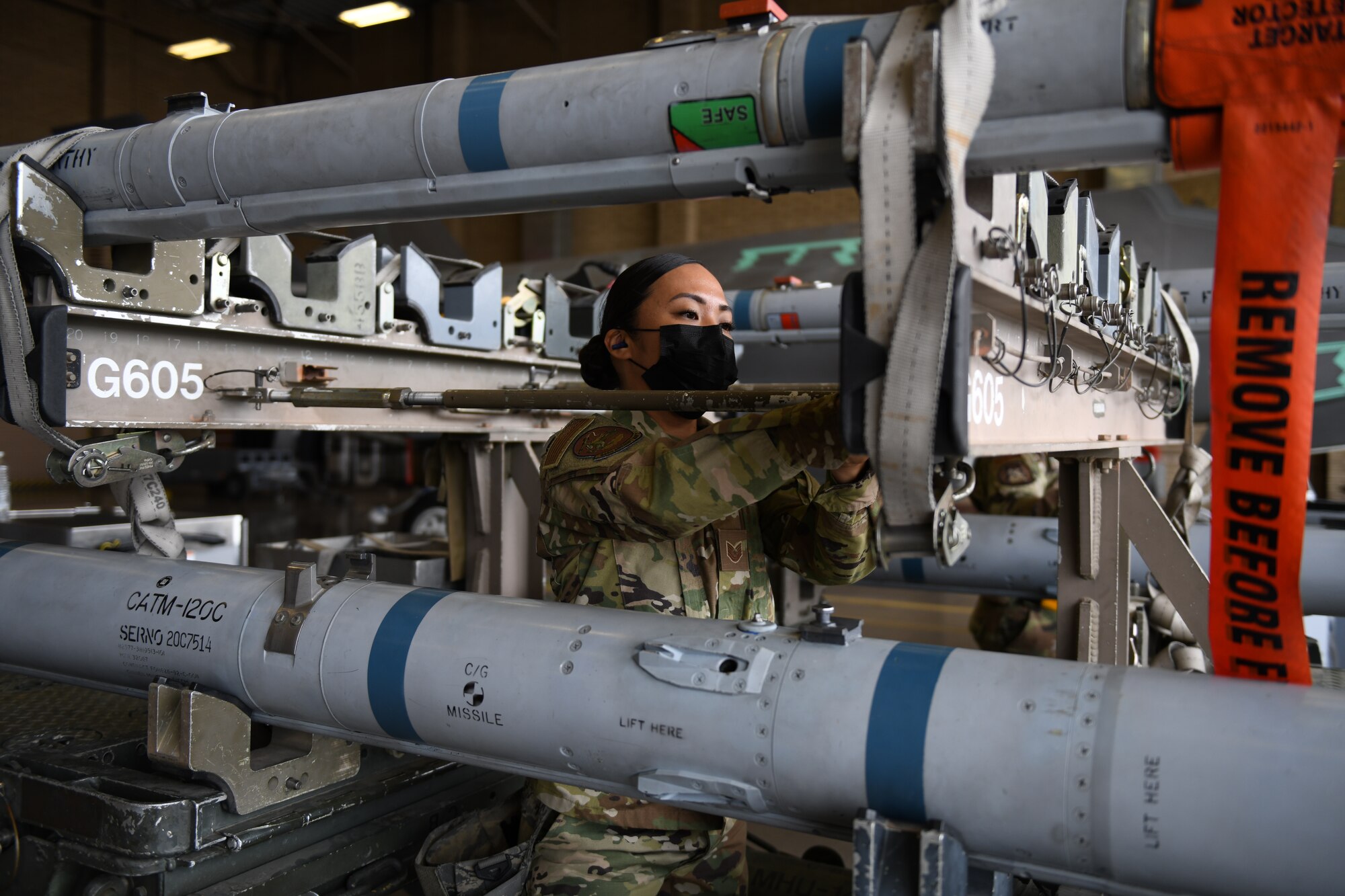 Tech. Sgt. Joyce Osornio-Magaña, 944th Fighter Wing weapons load technician, participates in an exhibition load March 25, 2021, at Luke Air Force Base, Arizona. The Women of Weapons Exhibition Load involved three teams made up of all women from different backgrounds, units, and ranks, honoring female maintainers for Women’s History Month. Diversity allows the Air Force to capitalize on all available talent by enabling a culture of inclusion. (U.S. Air Force photo by Staff Sgt. Amber Carter)