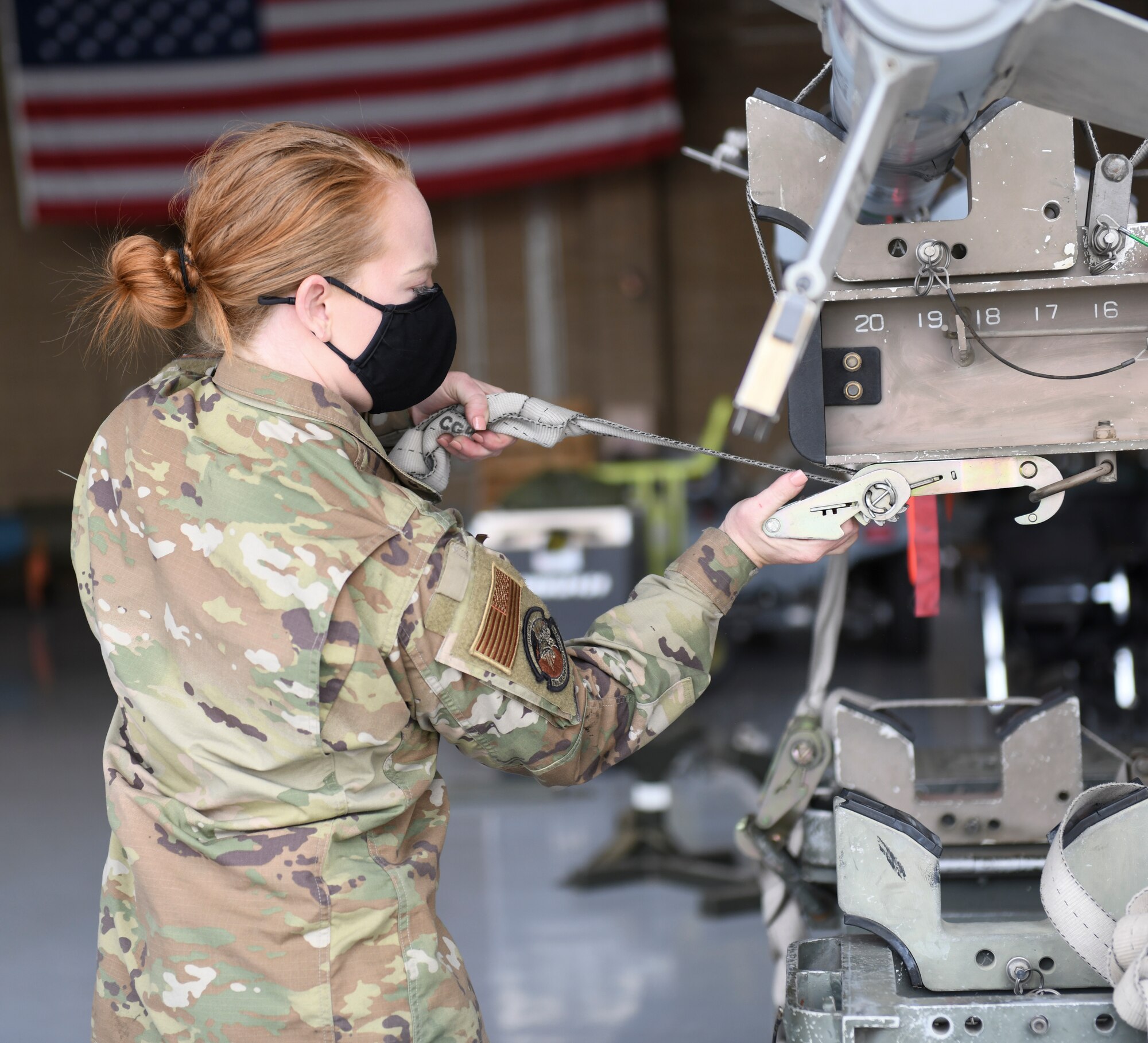 Senior Airman Riley St. John, 310th Aircraft Maintenance Unit weapons load technician, secures a missile March 25, 2021, at Luke Air Force Base, Arizona. St. John participated in the Women of Weapons Load Exhibition as part of a three-person all-female team, loading a missile and a bomb on an F-16 Fighting Falcon. This load was the AMU’s way of highlighting the capabilities of female Airmen as part of a Women’s History Month event. Diversity allows the Air Force to capitalize on all available talent by enabling a culture of inclusion. (U.S. Air Force photo by Staff Sgt. Amber Carter)