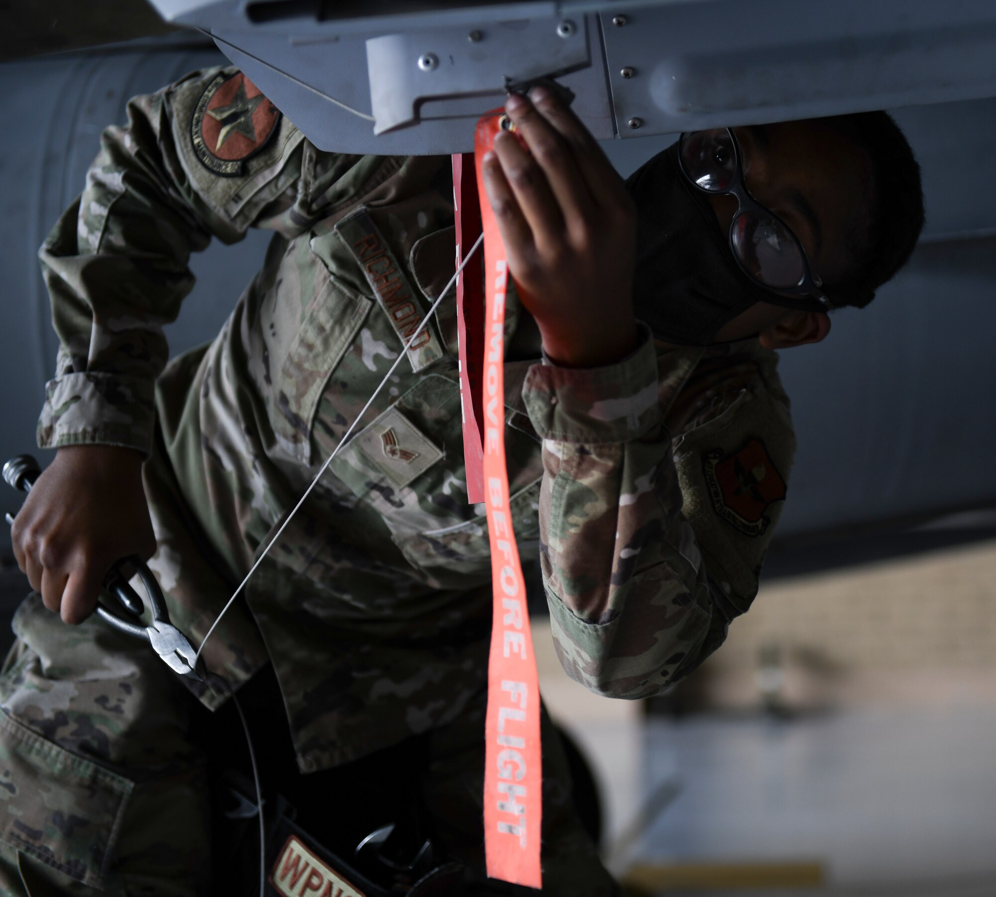 Senior Airman Felicia Richmond, 56th Component Maintenance Squadron weapons load technician, participates in the Women of Weapons Exhibition Load March 25, 2021 at Luke Air Force Base, Arizona. Richmond was part of a three-person team made of female Airmen from different units, highlighting the capabilities of women in the weapons load career field. Diversity allows the Air Force to capitalize on all available talent by enabling a culture of inclusion. (U.S. Air Force photo by Staff Sgt. Amber Carter)