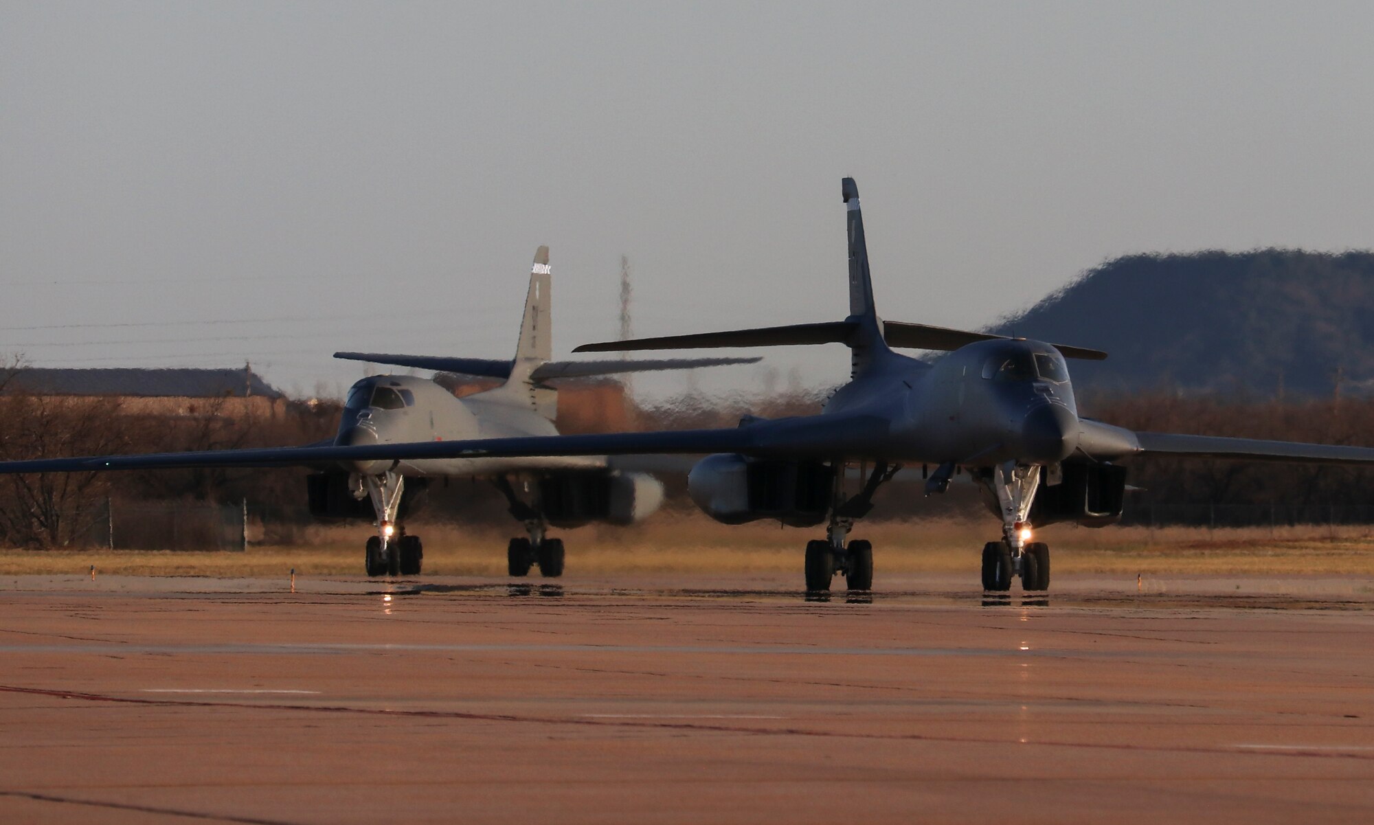 Two B-1B Lancers assigned to the 9th Expeditionary Bomb Squadron taxi on the flightline after returning from a Bomber Task Force Europe deployment in Norway at Dyess Air Force Base, Texas, March 23, 2021. The B-1B aircraft is a highly-versatile, supersonic, multi-mission weapon system that carries the largest payload of both guided and unguided weapons in the U.S. Air Force inventory. (U.S. Air Force photo by Staff Sgt. David Owsianka)