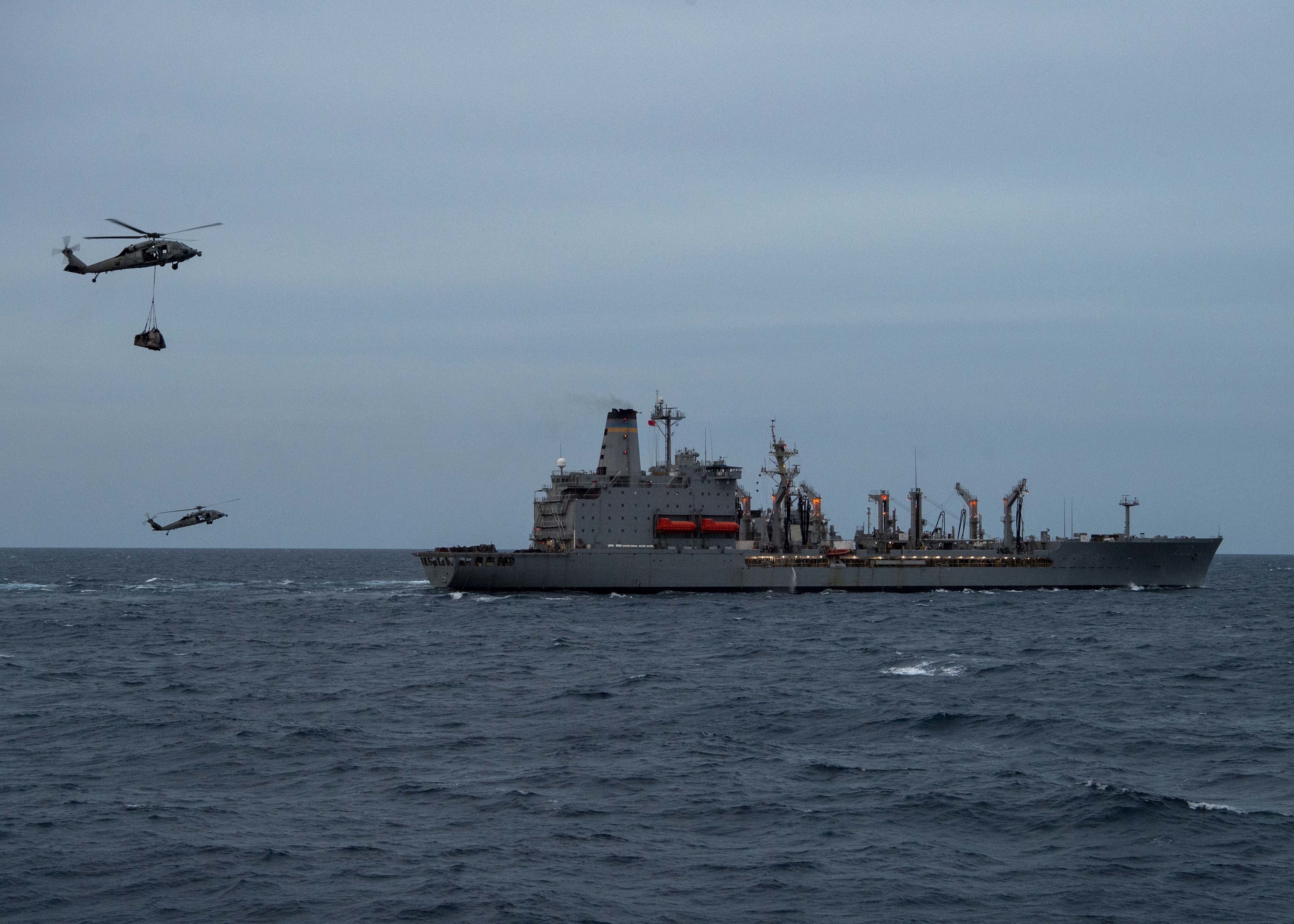 Two MH-60S Sea Hawks, assigned to the "Eightballers" of Helicopter Sea Combat Squadron (HSC) 8, airlift cargo from the Henry J. Kaiser-class fleet replenishment oiler USNS Guadalupe (T-AO 200) to the Ticonderoga-class guided-missile cruiser USS Bunker Hill (CG 52) during a vertical replenishment.