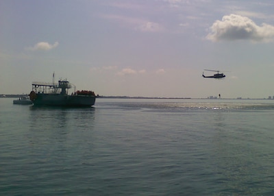 Students observe a helicopter hoist demonstration from the Big Dawg’s flight deck.