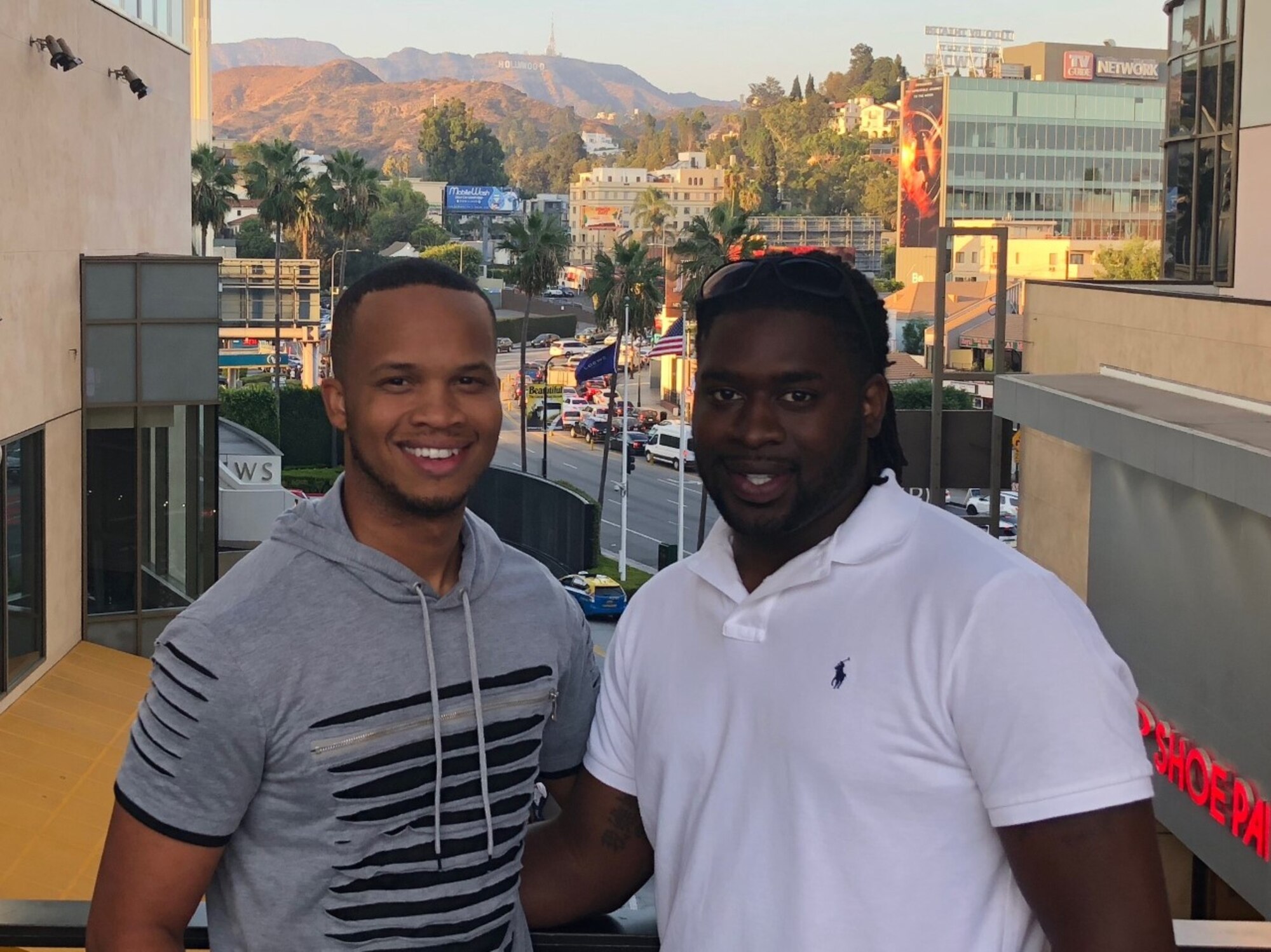 Mario and Monte Foreman-Powell pose for a photo together on vacation.