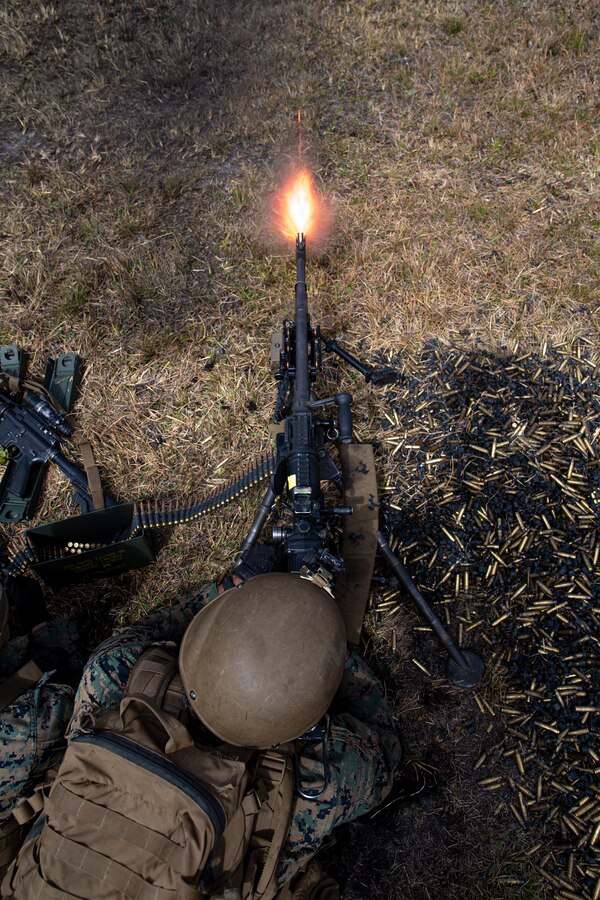 U.S. Marine Corps Pfc. Ryan Helm, a machine gunner with 2d Battalion, 6th Marine Regiment, 2d Marine Division, suppresses targets during range G-36 on Camp Lejeune, N.C., March 23, 2021.