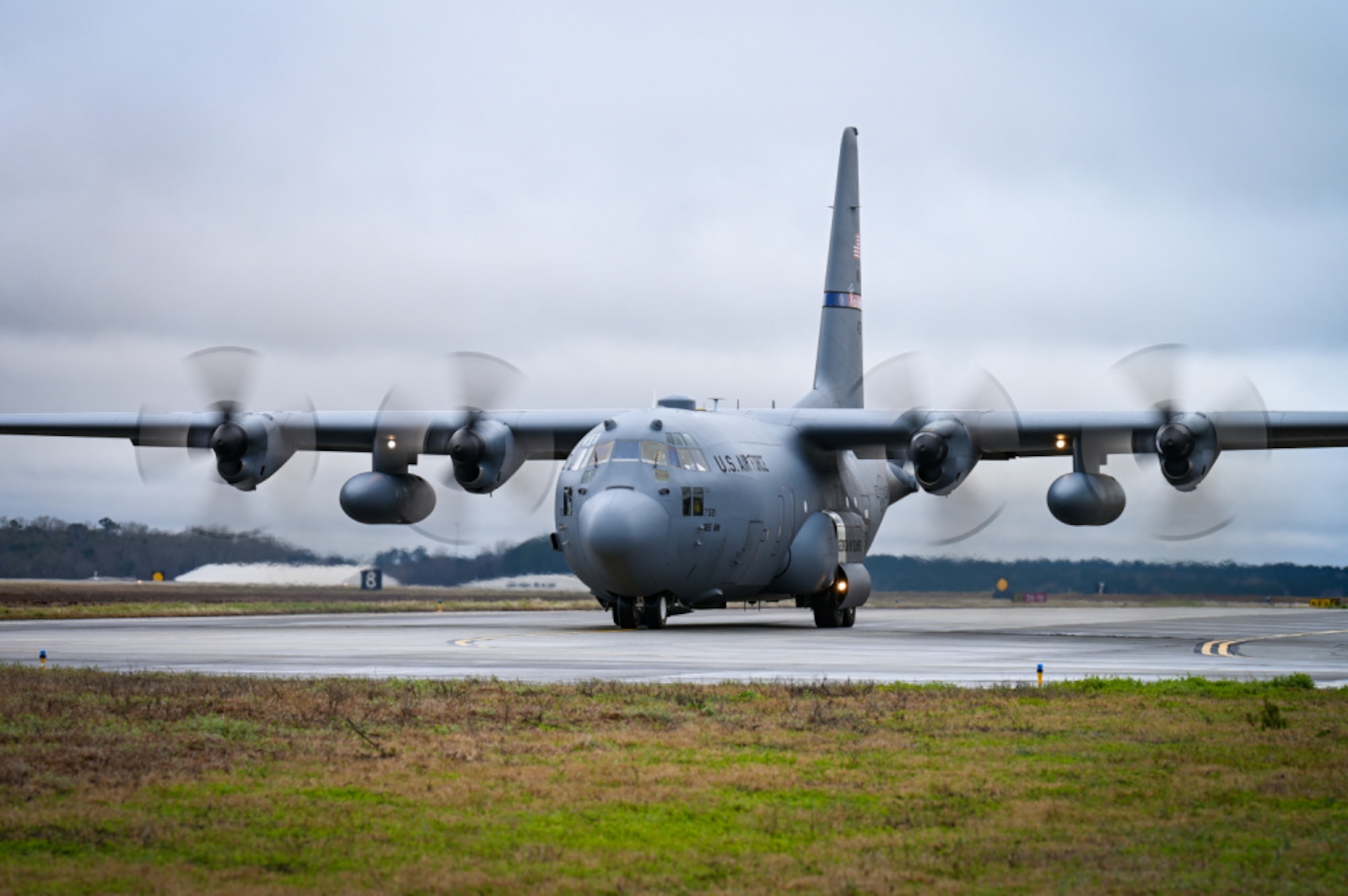 C-130 Hercules Aircraft taxiing while raining 