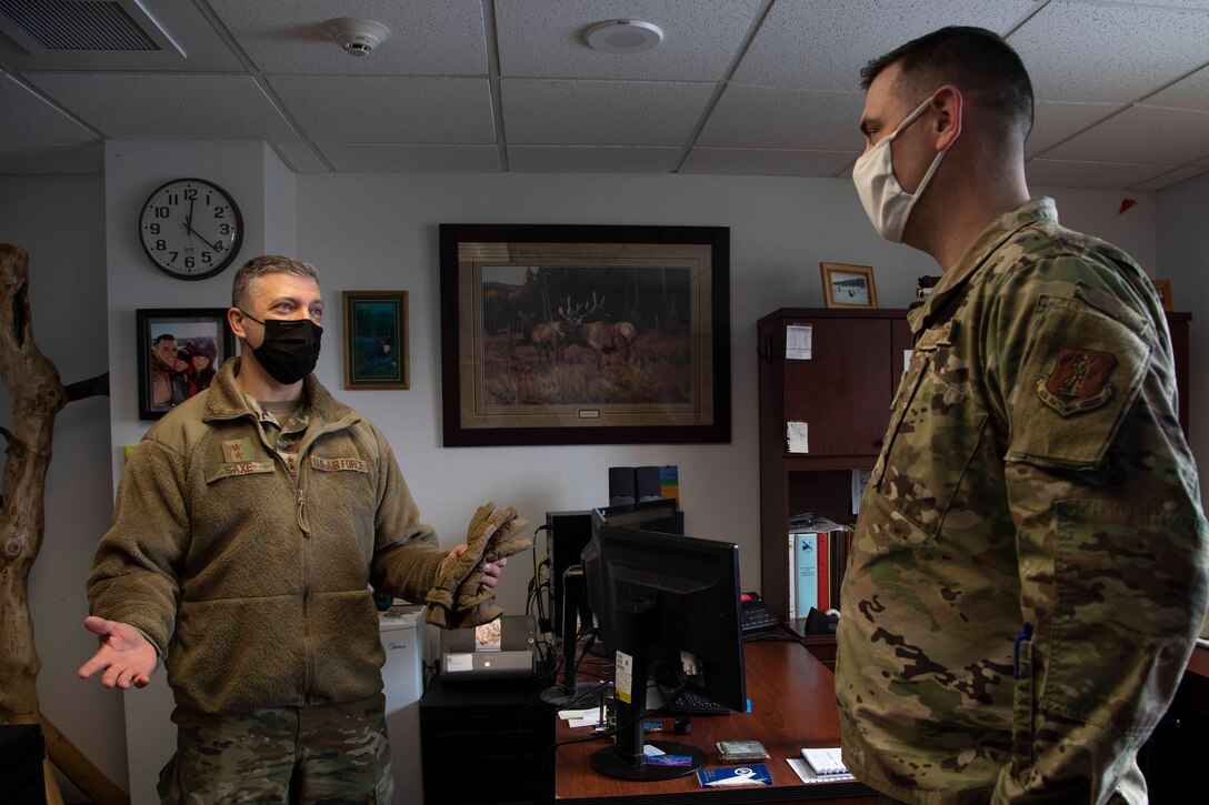 Maj. Gen. Torrence Saxe, adjutant general of the Alaska National Guard speaks with Chief Master Sgt. Jeffrey Porter during a visit to Eielson Air Force Base, Alaska, March 23, 2021. (U.S. Army National Guard photo by Victoria Granado)